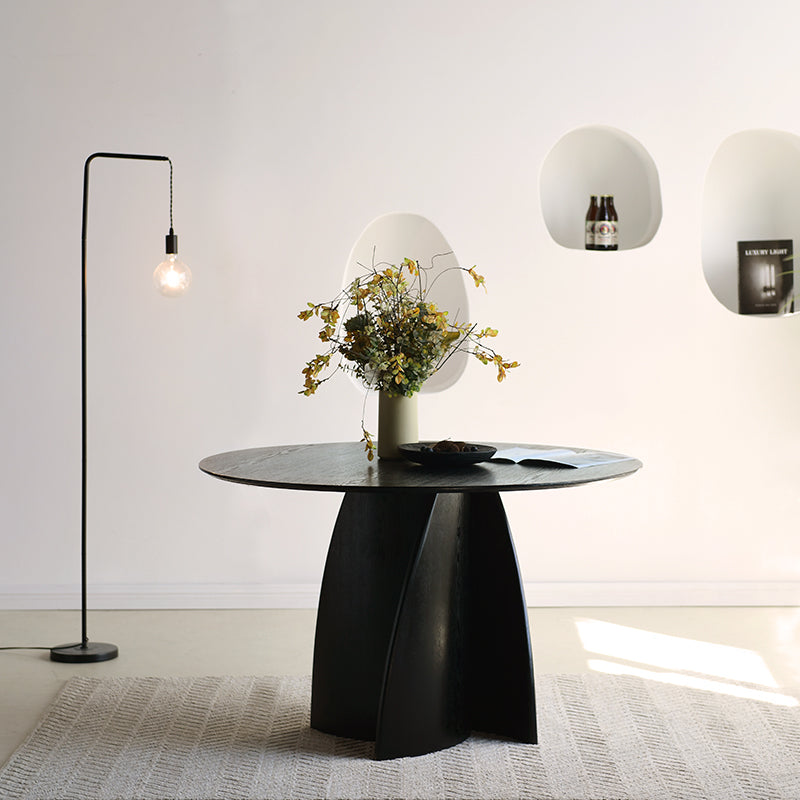 Mesa de jantar redonda Gemma UDT24012 em preto com tampo de MDF resistente e base em madeira laminada, perfeita para salas de jantar modernas.